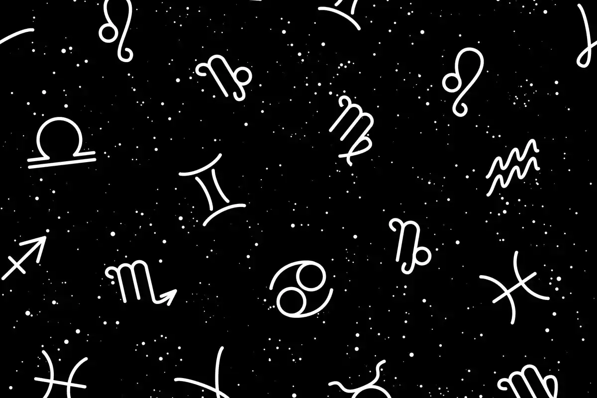 Los signos del zodíaco en blanco por un cielo negro y estrellado